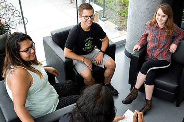 A group of students sitting in the common area at Humber College.