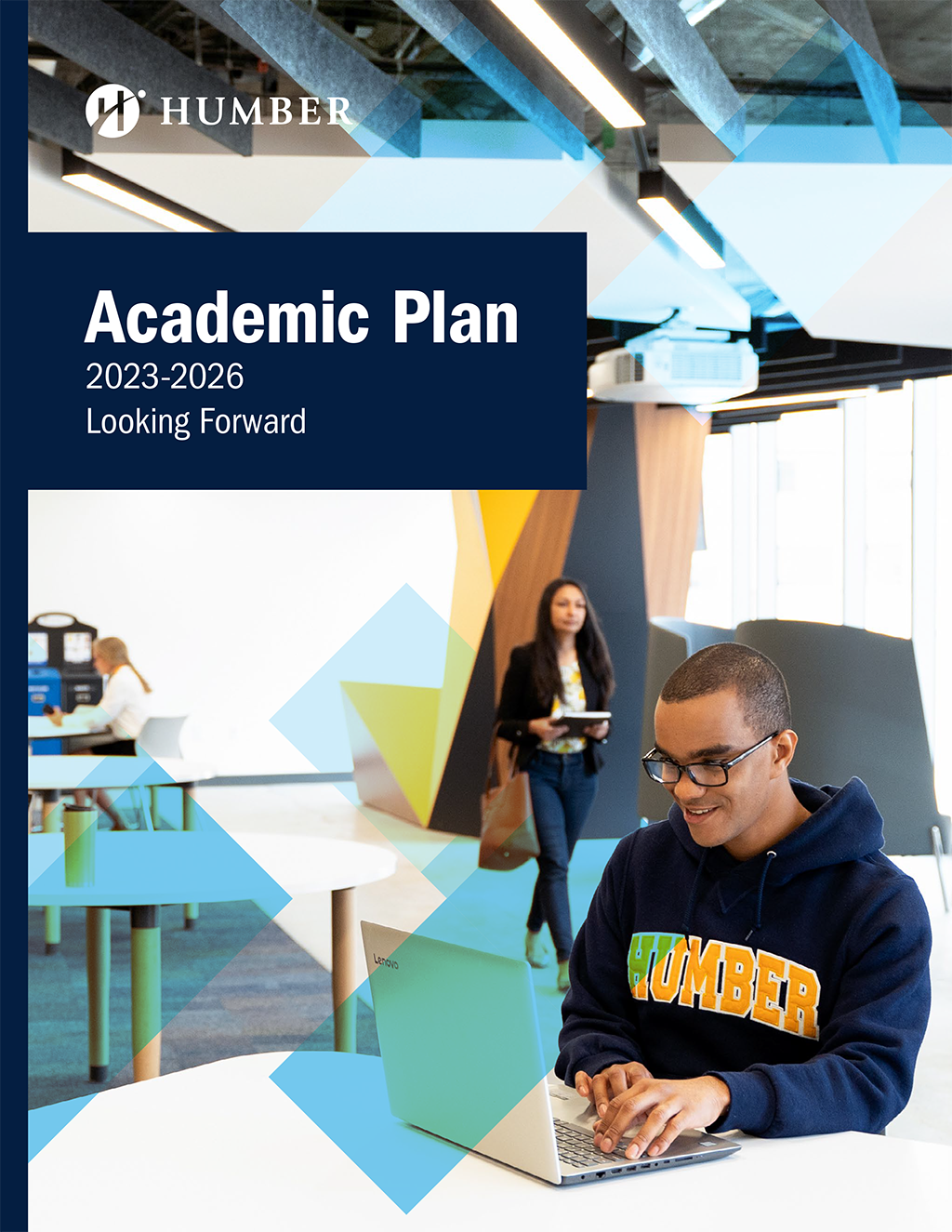 Academic Plan PDF cover - student working on a laptop, another student walks towards him in the background