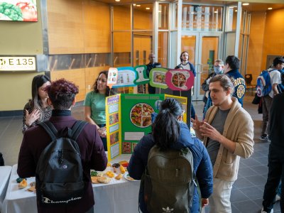 students gathered around display on Canada's food guide