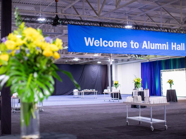 Reception area with a sign saying Welcome to Alumni Hall