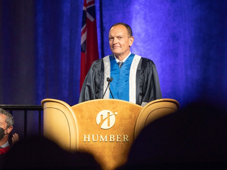 Former Humber president Chris Whitaker standing at the Humber podium