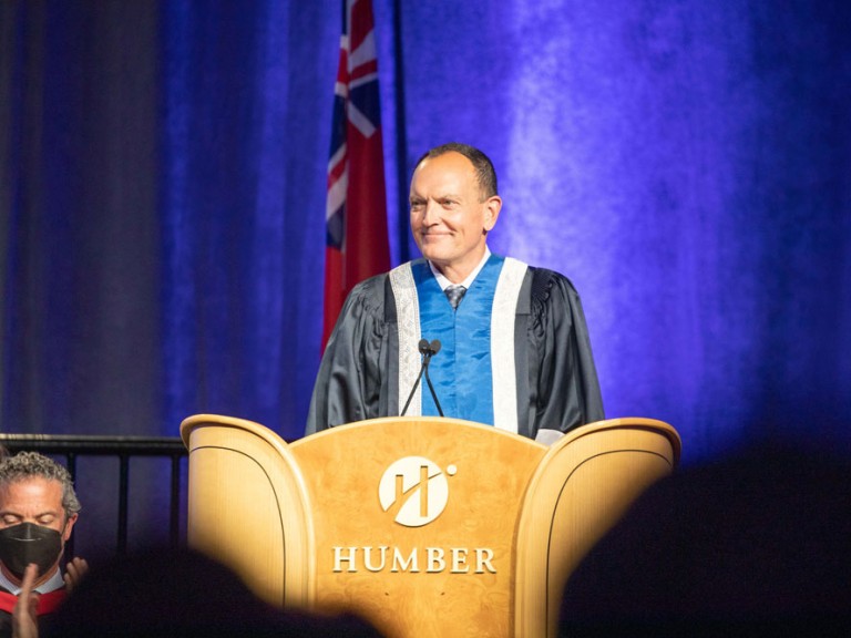 Former Humber president Chris Whitaker behind the podium