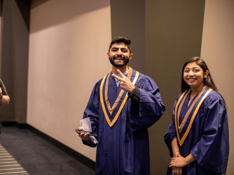 Two Humber Graduates in commemorative attire