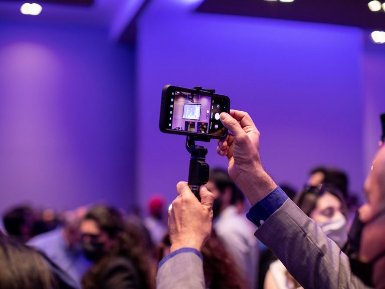 Person taking photos of Humber Graduation