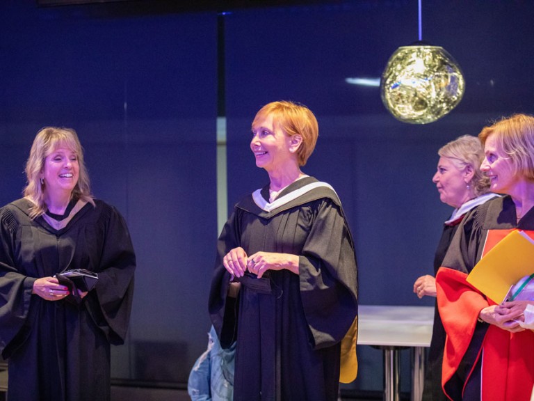 Group of Humber Faculty smiling on stage