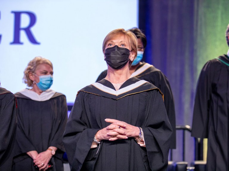 Humber faculty on stage wearing face masks
