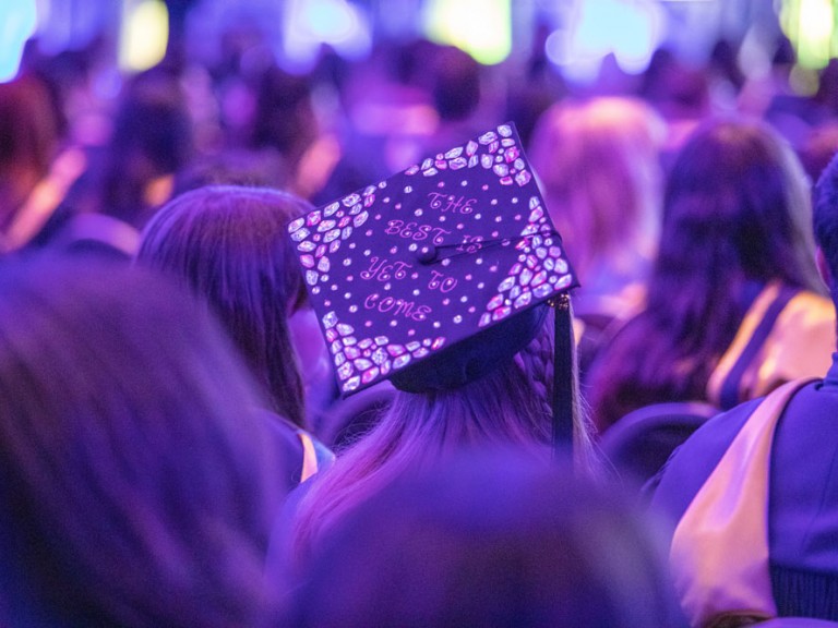 Humber Graduate with text on graduation cap: The best is yet to come.