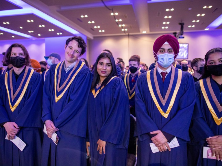 group of graduates posing for camera