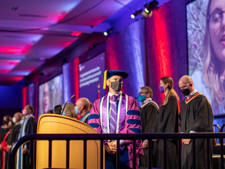 Ceremony speakers and faculty on stage