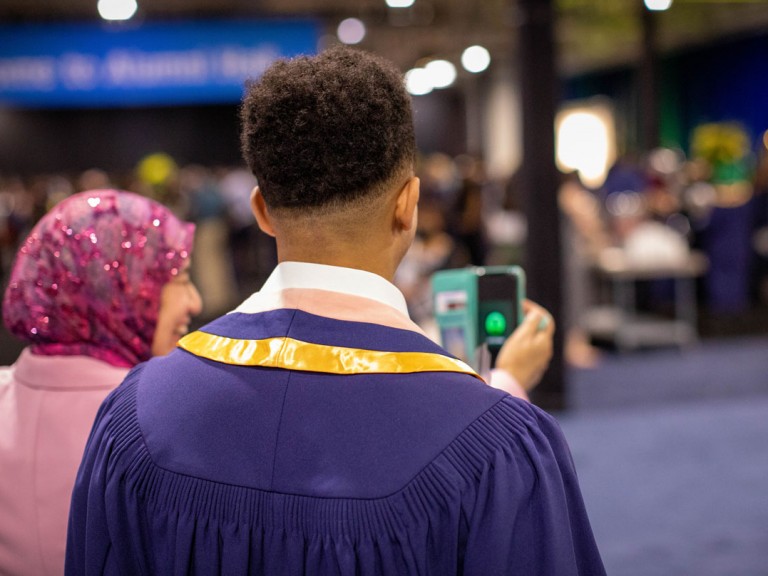 back of person in graduation outfit