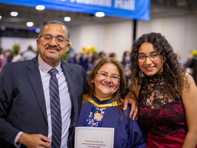 Humber graduate smiling with family