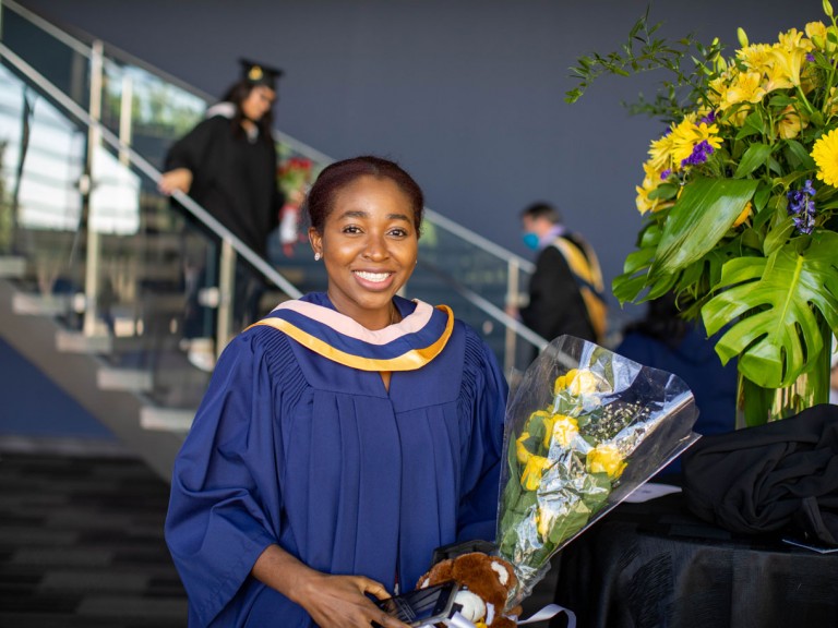 Humber graduate with flowers
