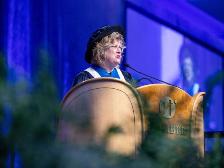 Ann Marie Vaughn speaking at podium