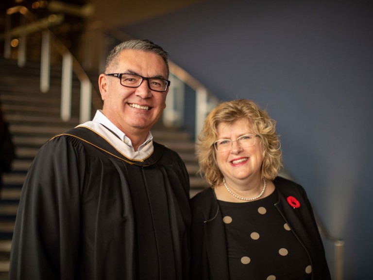 Humber president smiling with Faculty member