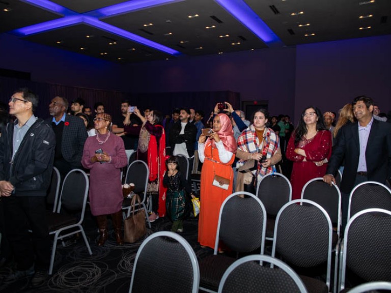 People in audience look at stage