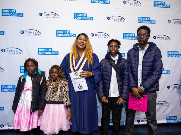 Humber graduate takes photo with family members