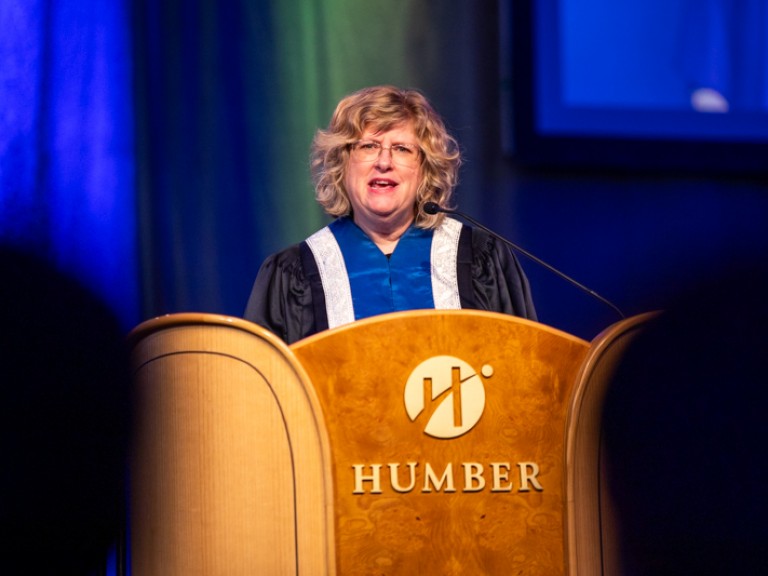 Humber president Ann Marie Vaughan speaking behind podium