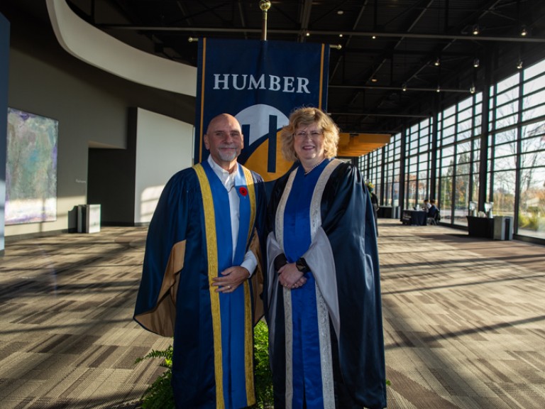 Humber president Ann Marie Vaughan takes photo with another faculty member