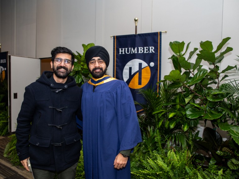 Graduate takes photo with family member