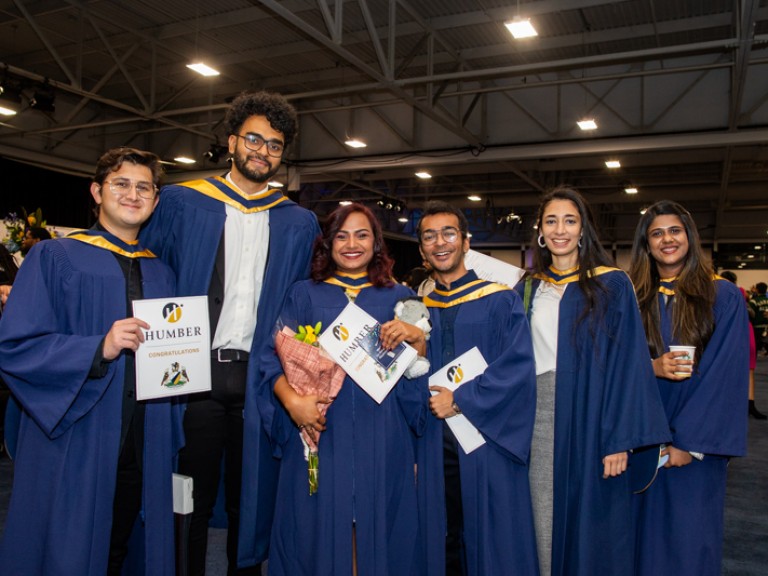 Six graduates take photo together