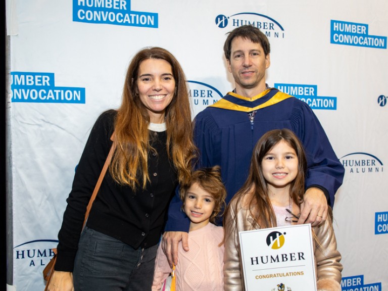 Graduate takes photo with family