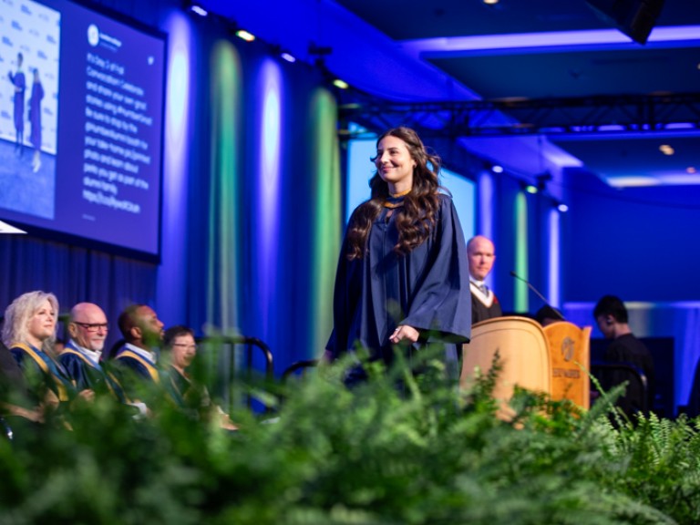 Graduate walking across stage