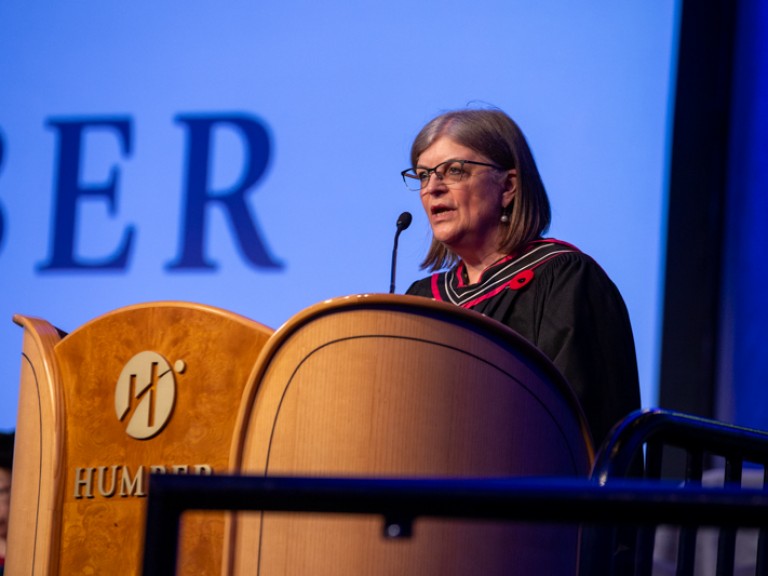 Person speaking behind podium