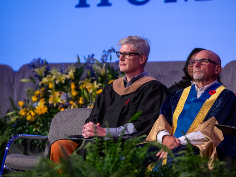 People seated on stage