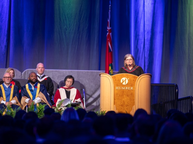 Person behind Humber podium on stage