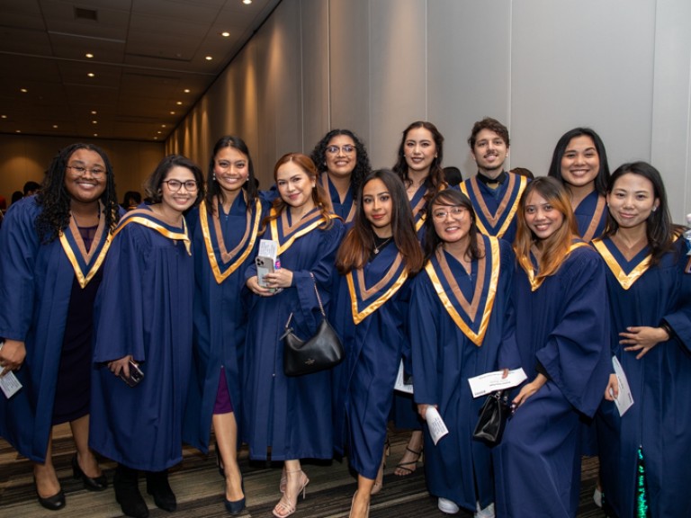 Group of graduates take photo 
