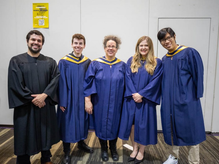 Fives graduates smiling for photo