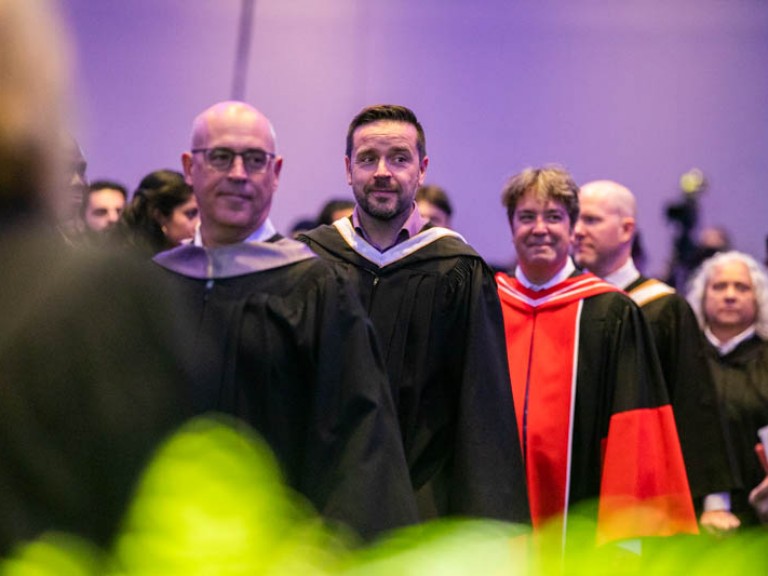 Humber faculty entering the ceremony hall in a line