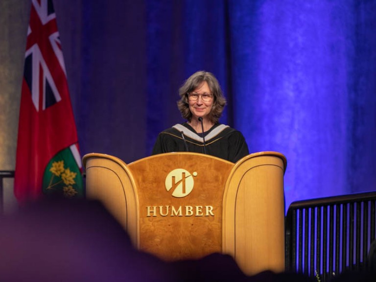 Person behind Humber podium smiling