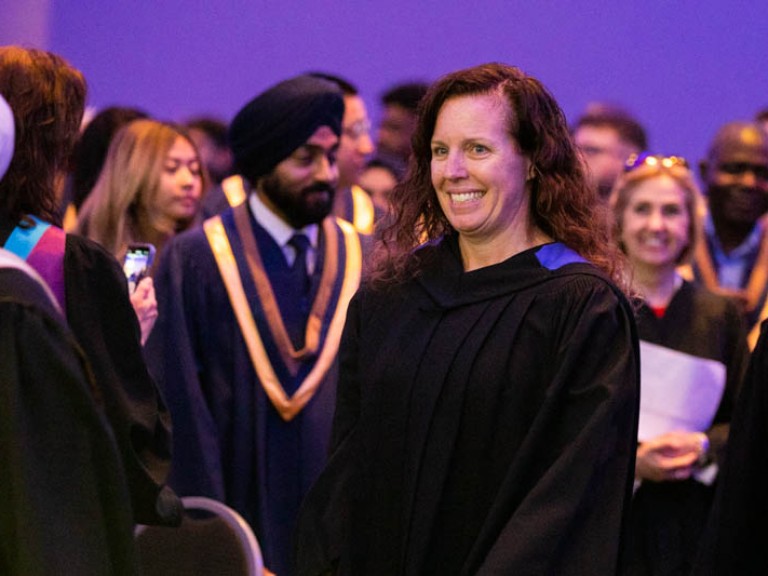 Faculty member smiling