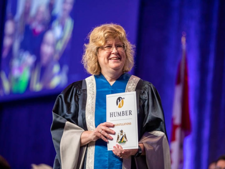 Ann Marie Vaughan holding certificate