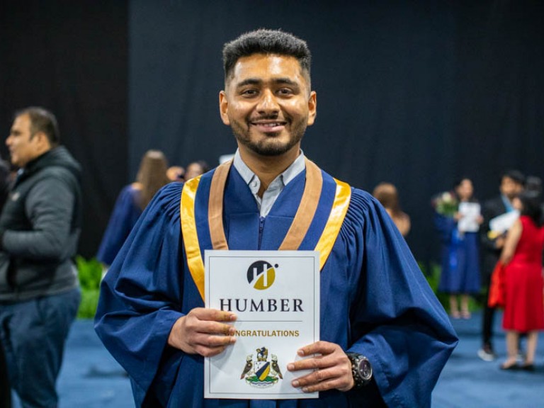 Graduates smiling with certificate