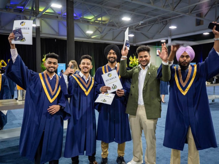 Five graduates pose for photo