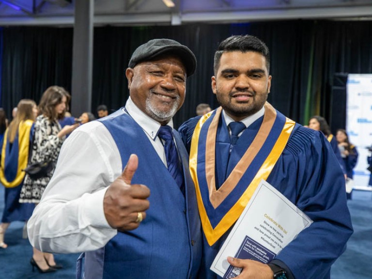 Graduate poses with his dad