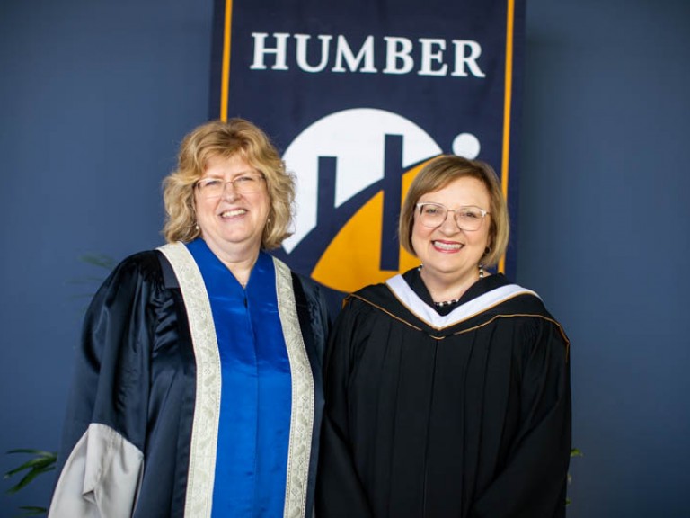 Lana Payne posing for photo with Humber president Ann Marie Vaughan