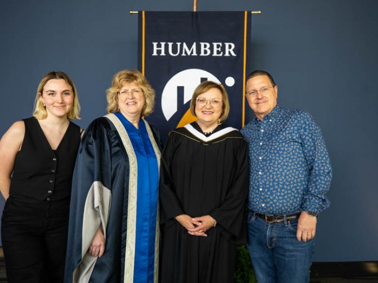 Lana Payne and two family members take photo with Ann Marie