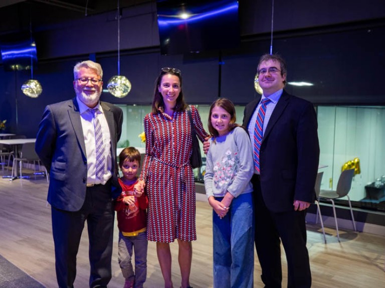 Honorary degree recipient Andrew Monkhouse poses for photo with family