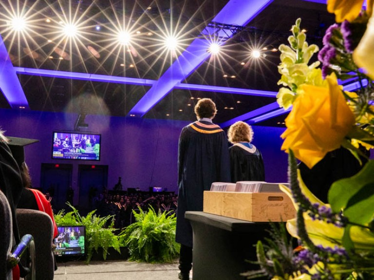 View of graduate beside Ann Marie from behind