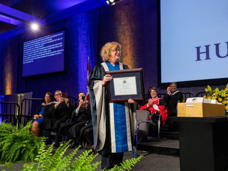 Humber president Ann Marie Vaughan holding framed degree