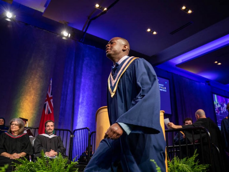 Graduate walking across stage