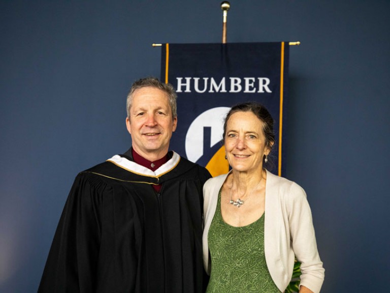 Jim Estill poses with ceremony guest