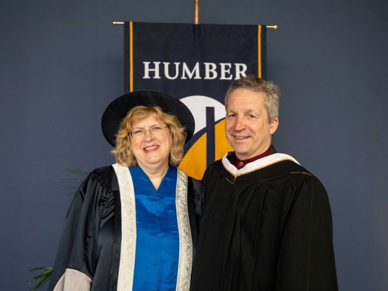 Jim Estill poses with Humber president