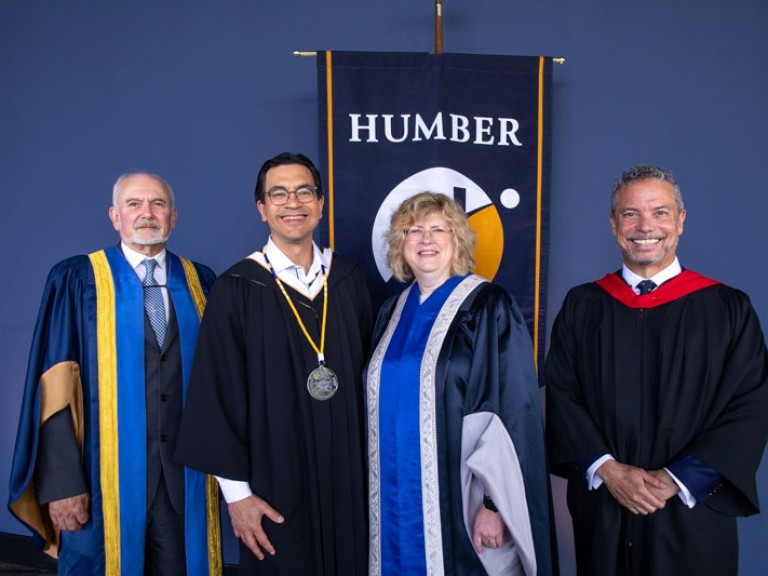 Four people including Humber president and honorary degree recipient pose for photo