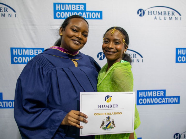Graduate poses with family member