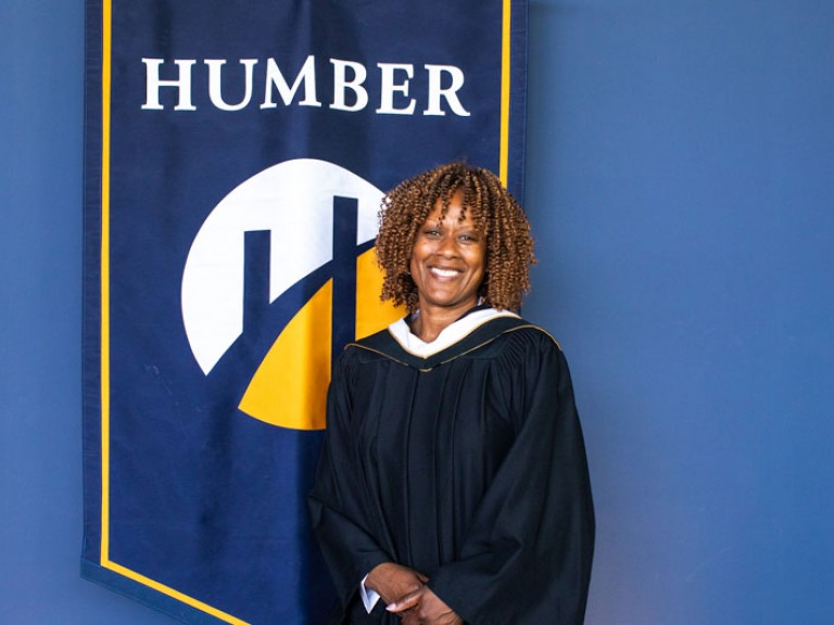 Honorary degree recipient Jacqueline Edwards smiles for photo