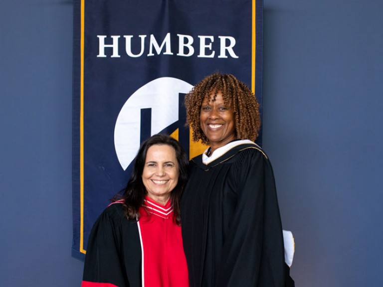 Honorary degree recipient Jacqueline Edwards smiles for photo with Humber faculty member